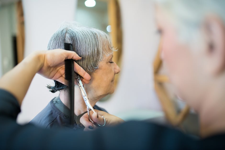 Elderly woman receiving a haircut in a trendy Portuguese hair salon